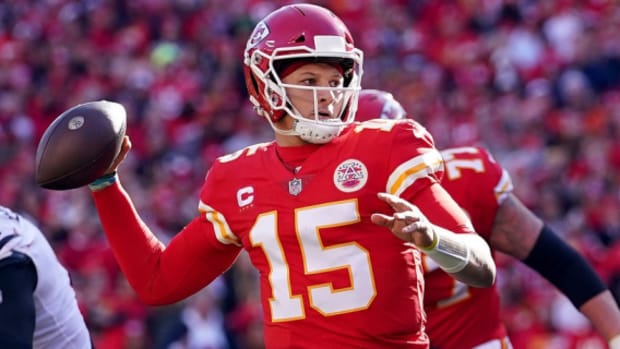 Kansas City Chiefs quarterback Patrick Mahomes attempts a pass during a game on the NFL schedule.